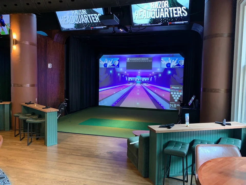 A virtual bowling game projected inside a PSC sports suite